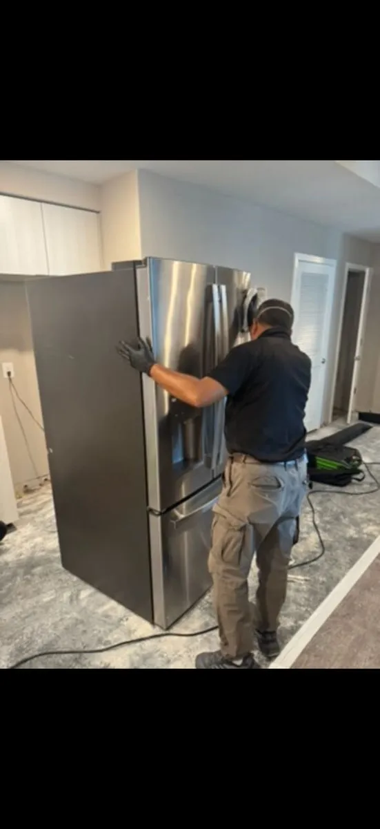ASAP Pro technicians performing contents pack-out and soot cleaning after a residential fire