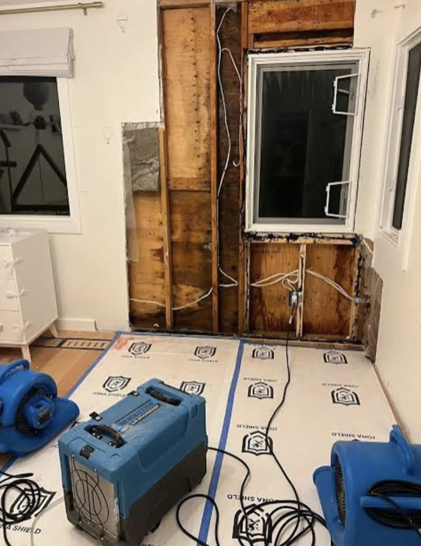 ASAP Pro water damage restoration in progress with dehumidifiers and air movers